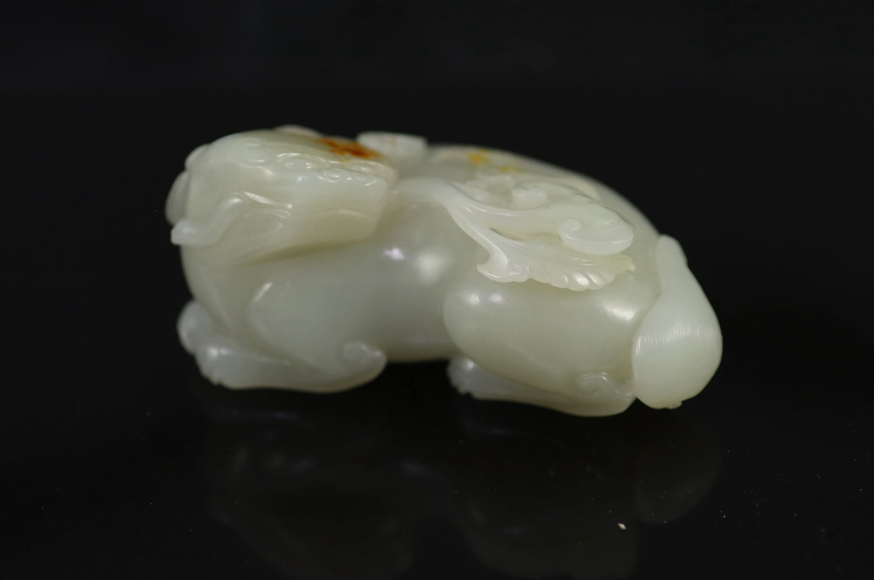 A Chinese pale celadon jade figure of a pixiu, 8.3 cm long